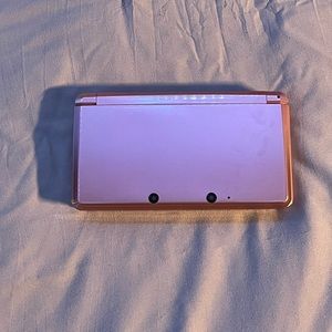 pink Nintendo 3DS with super mario case!
